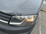 a close up of a car ' s headlight on a parking lot