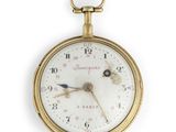 an image of a close up of a pocket watch on a white background
