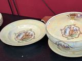 five cups and saucers on a table with a red background