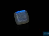 an image of a square blue stone with a black background