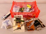 a red basket filled with assorted items on a table