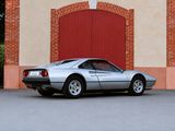 a silver sports car parked in front of a building