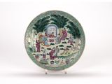 an image of a plate with a painting of people in a garden