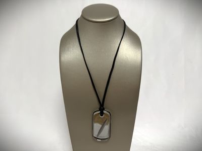 a close up of a necklace on a mannequin mannequin