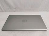 a laptop that is sitting on a white surface
