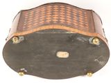 a brown and black suitcase sitting on a white surface
