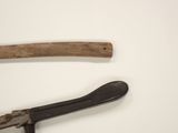 two old tools that are on a white surface