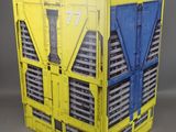 an image of a yellow and blue crate sitting on top of a table