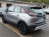 a silver car parked on the side of the road