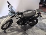 a motorcycle that is sitting on a checkered floor