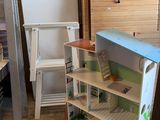 a doll house that is in the corner of a room