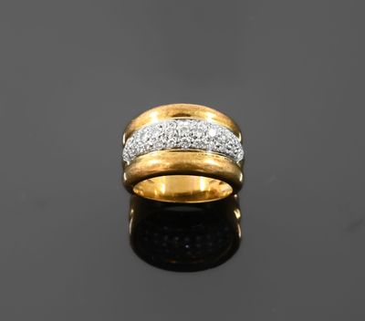 a close up of a gold and diamond ring on a black surface