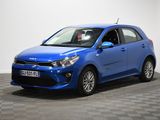 a blue car parked in a room with a checkered floor