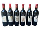 six bottles of red wine lined up in a row