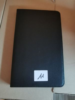 a black leather case with a white sticker on it