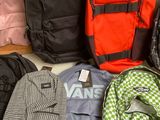 a lot of backpacks that are sitting on the floor