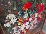 a picture of a painting of flowers on a chair