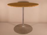 a small wooden table with a metal base on a white surface