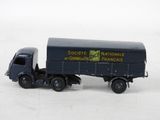a toy truck that is sitting on a white surface