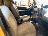 the interior of a car with a steering wheel and a seat in it