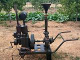 a small machine that is sitting in the middle of a field