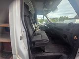 a white van with the door open and the driver ' s seat down