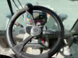 a steering wheel of a tractor with a steering wheel on it