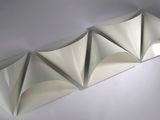 a white origami paper sculpture on a white surface