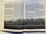 an open book with a picture of a farm in the background