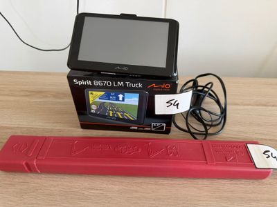 a small red device sitting on a table next to a charger
