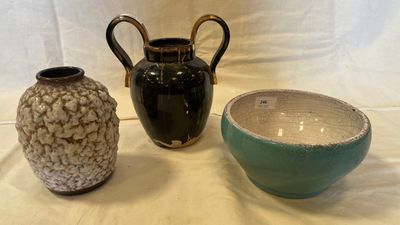 three vases sitting next to each other on a table