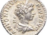 a silver coin with an image of a woman on it
