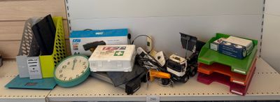 a desk with a bunch of office supplies on top of it