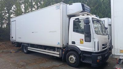 a white truck that is parked in a lot