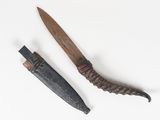 an old knife and a small knife on a white surface