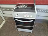 a white stove with two burners on top of it