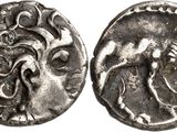 a close up of a silver coin with a horse on it