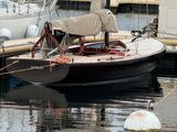 many boats docked in the water at the dock