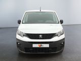 the front view of a white van parked in a room