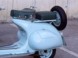 a scooter that is parked in a parking lot