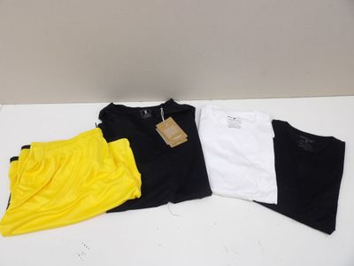 three t - shirts are sitting on a white table next to each other