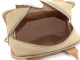 beige leather handbag on white background with zipper open