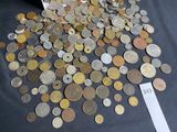 a pile of coins on a table with a price tag