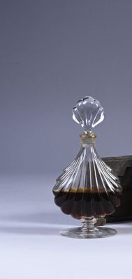a glass decanter with a glass stopper on it