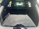 a trunk of a car with the back door open