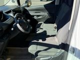 the interior of a car with the door open and the driver ' s seat down