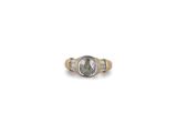 a close up of a ring with a stone in the middle