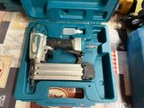 a blue tool box with a stapler and a stapler in it