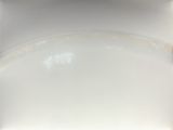 a white plate with a rainbow in the middle of it