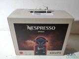 a box that has a coffee machine inside of it
